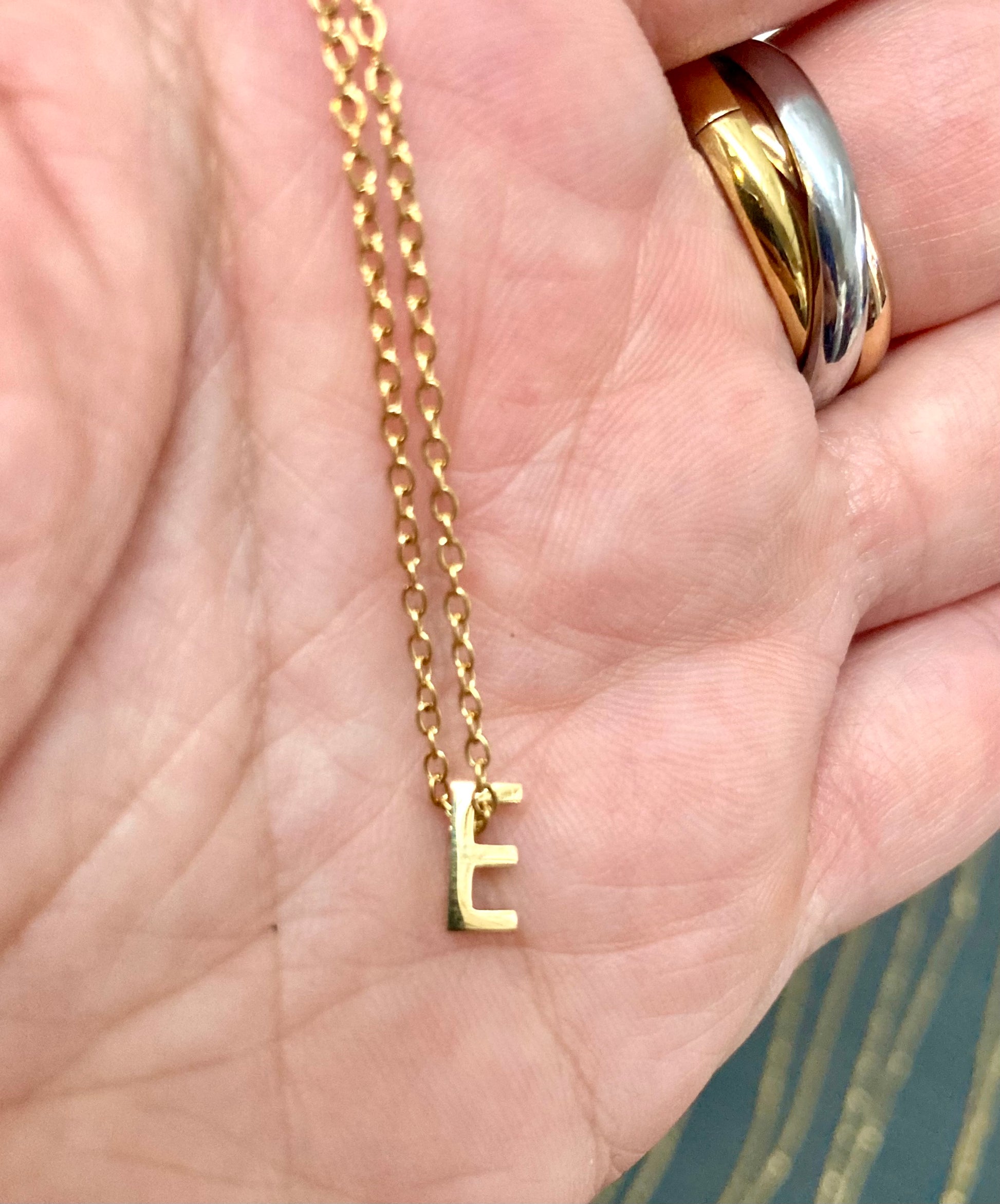 Letter E gold pendant