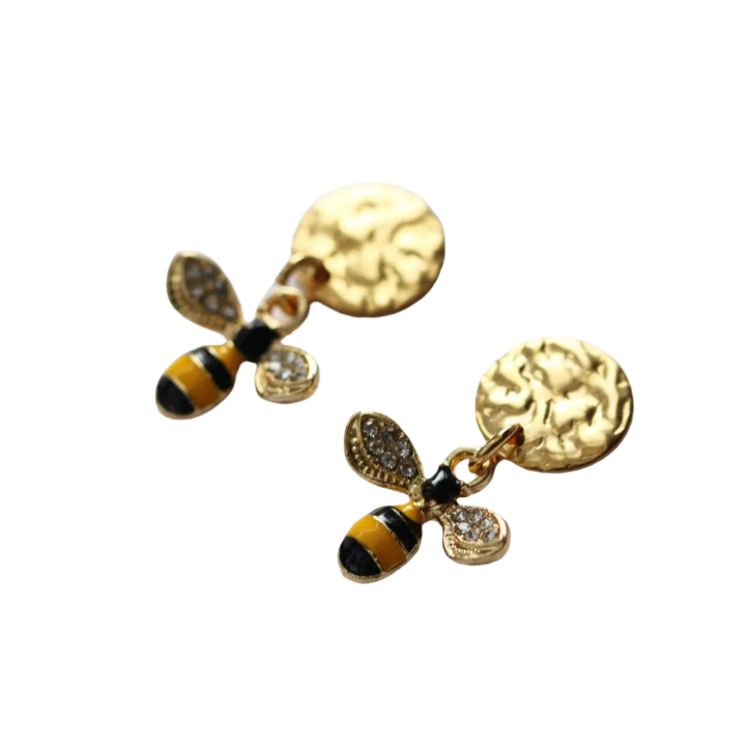 Gold-plated stainless steel bee earrings with black and yellow accents on a white card.