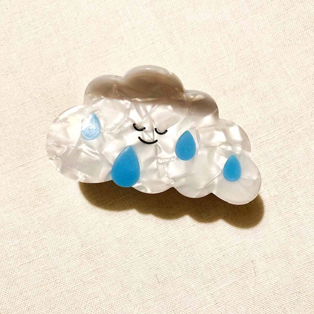 rain-cloud hair claw with smily face and drips of blue rain