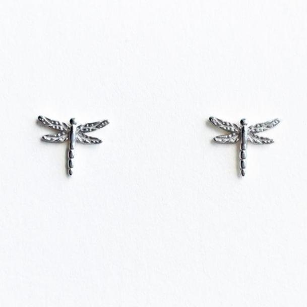 A pair of sterling silver dragonfly stud earrings on a white background.