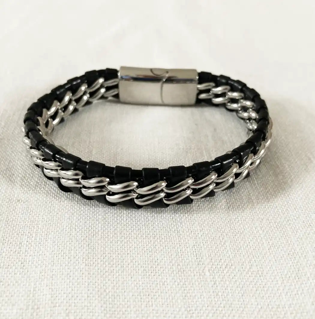 Black and silver braided bracelet on a white background