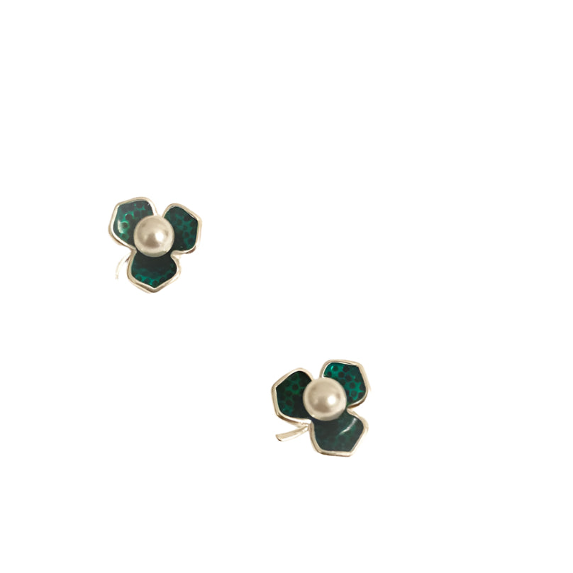 Flower-shaped earrings on a card with 'SHB Studio' branding.