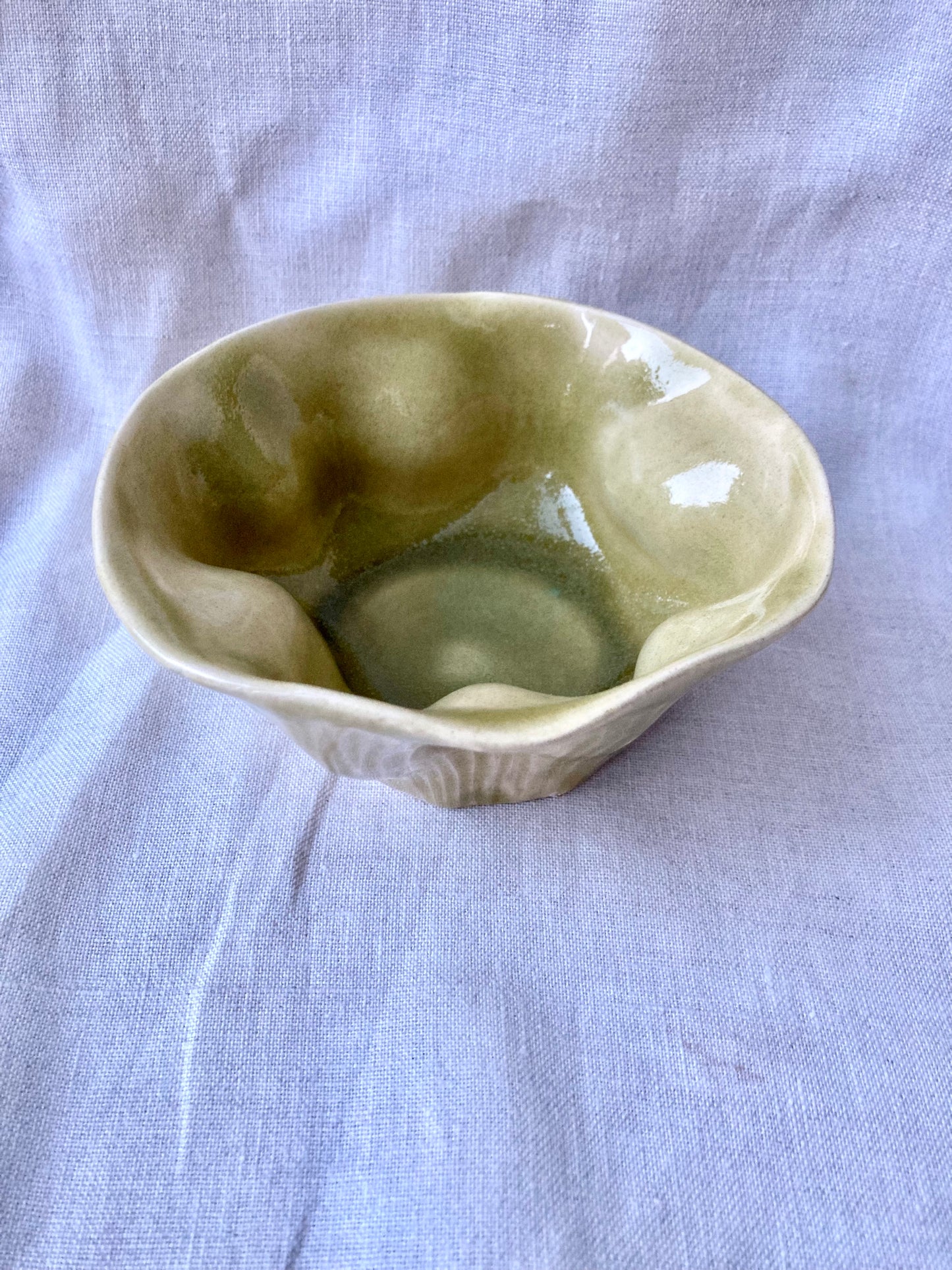Olive glazed pottery cup