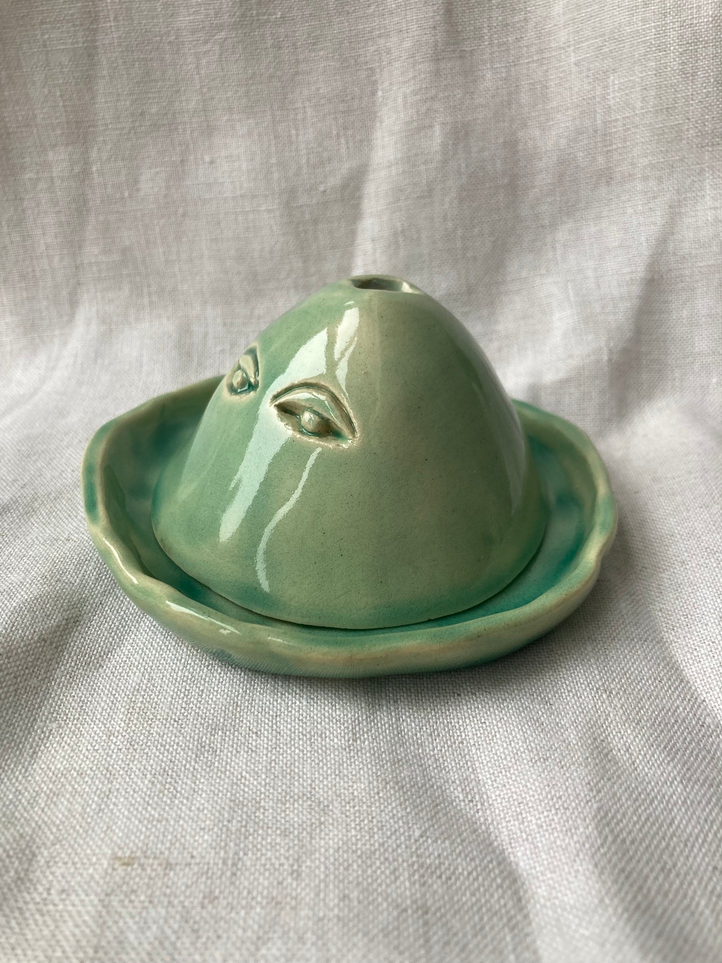 Minimalist green pottery vessel