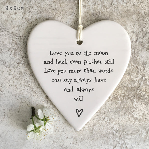 White porcelain hanging heart reading Love You to the Moon, a gentle Christmas remembrance gift