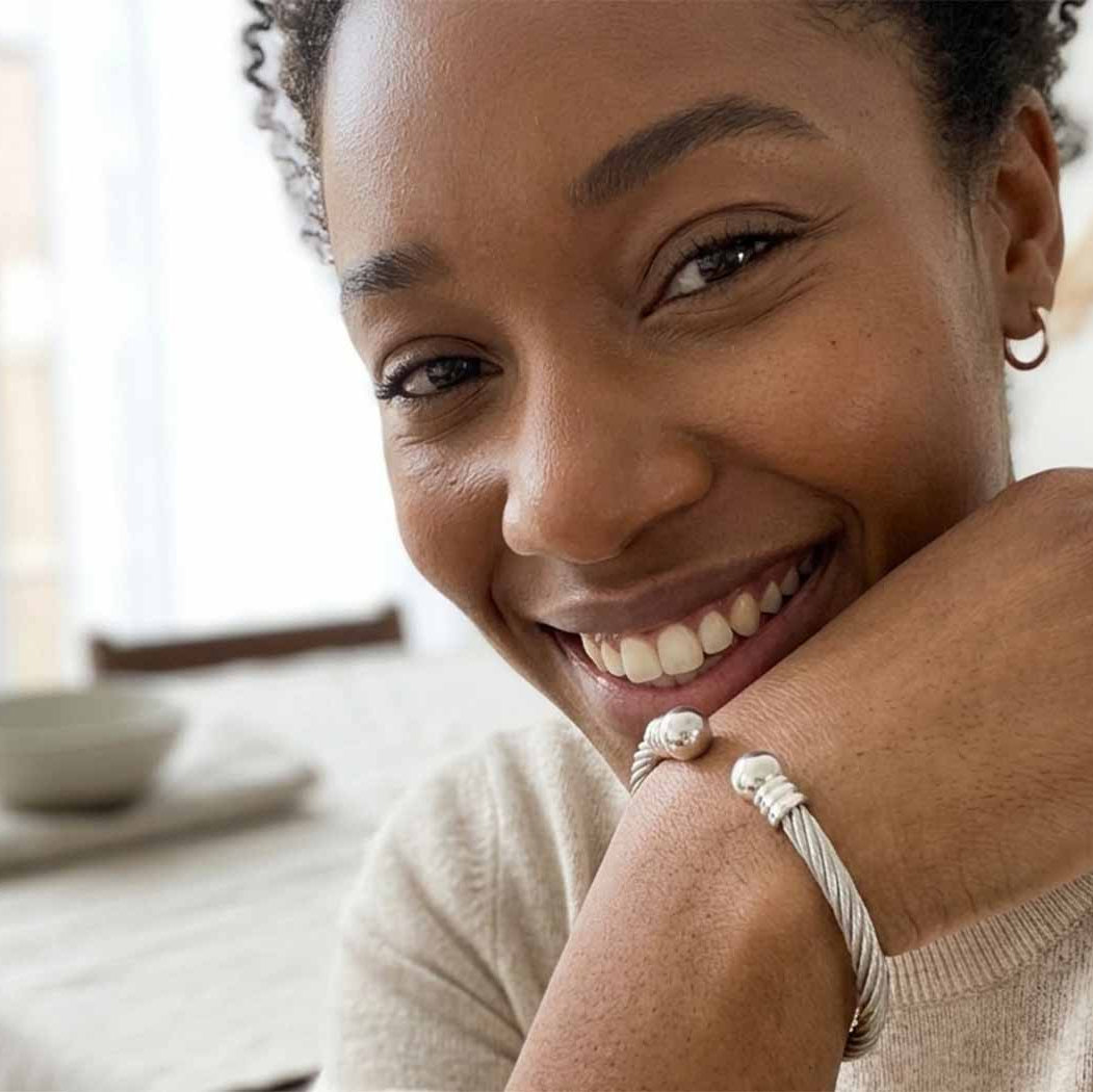 woman wearing adjustable stainless steel bangle