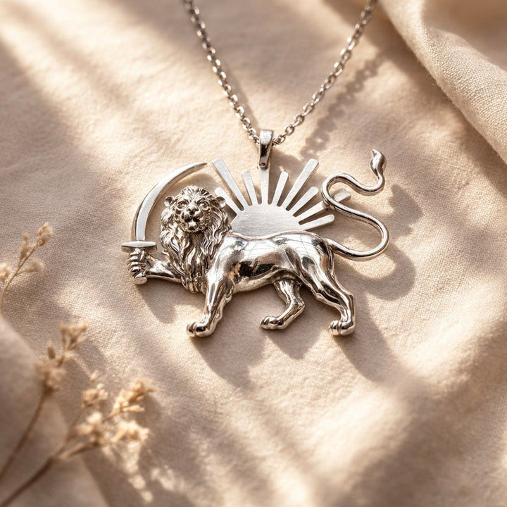 Silver lion pendant necklace on a beige fabric background