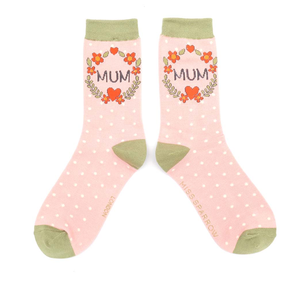 Pair of pink polka dot socks with &
