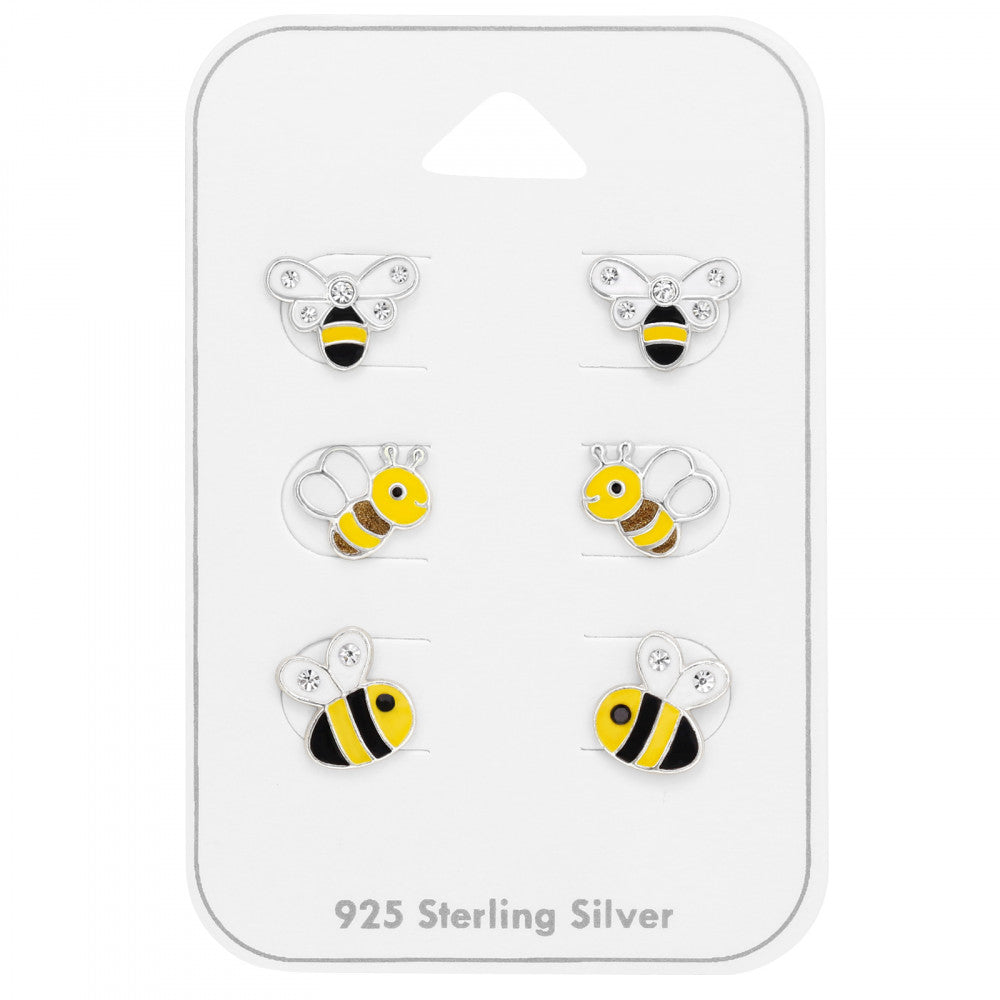 Set of three pairs of bumble bee stud earrings in sterling silver on a gift card