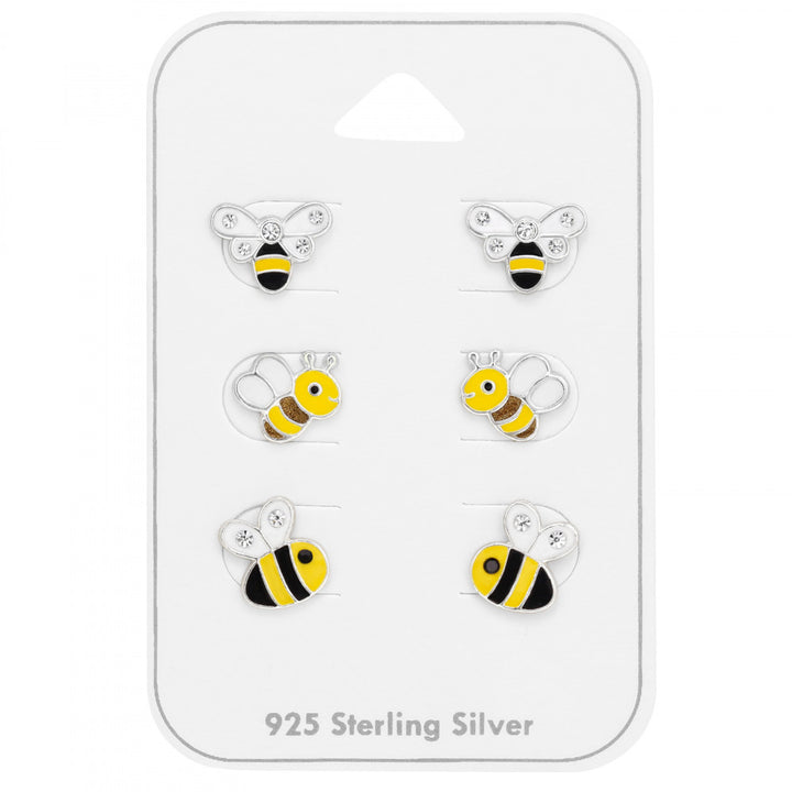 Set of three pairs of bumble bee stud earrings in sterling silver on a gift card