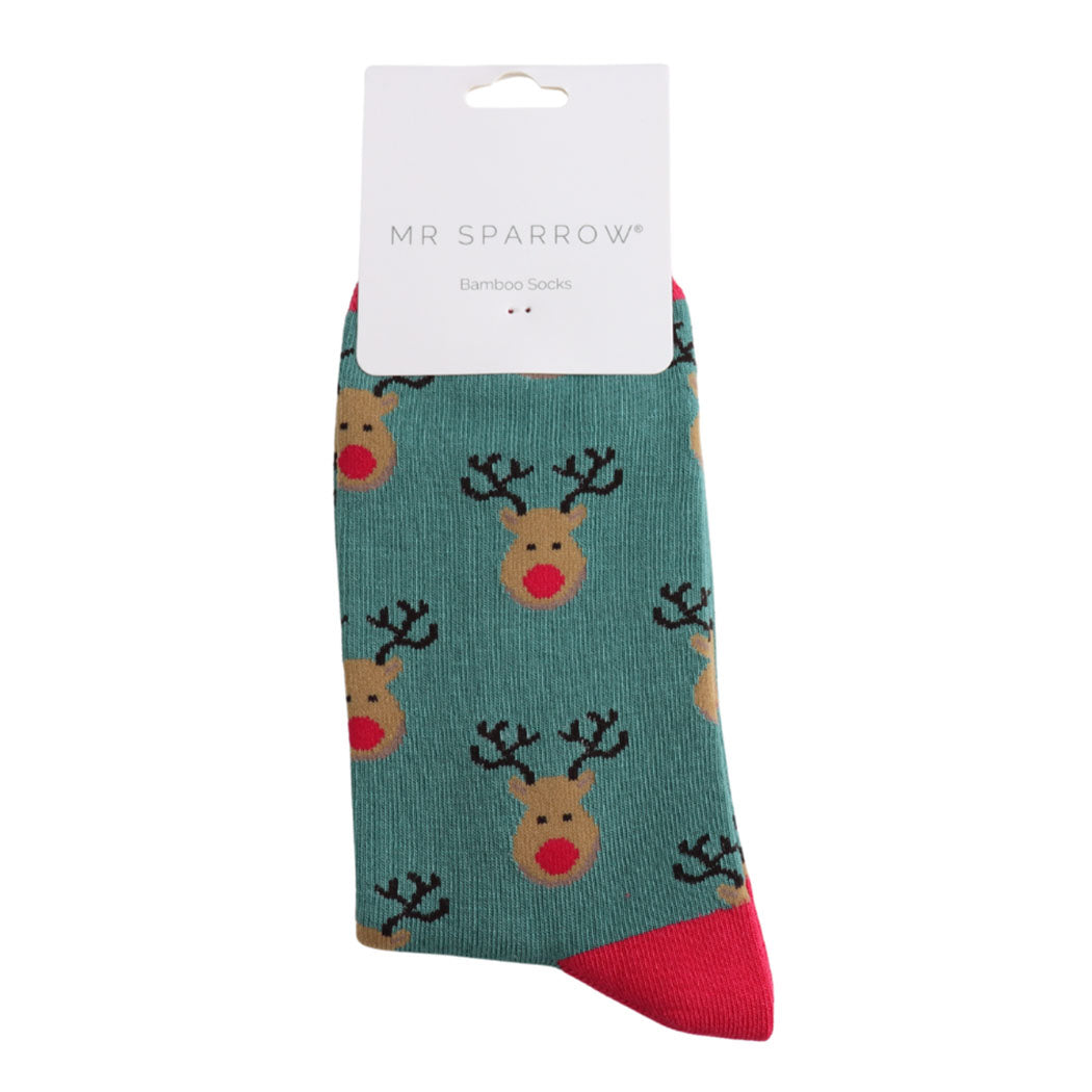 Teal sock with reindeer pattern and red accents, branded &