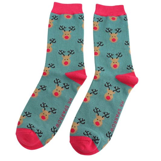 Teal socks with reindeer pattern and pink accents on a white background