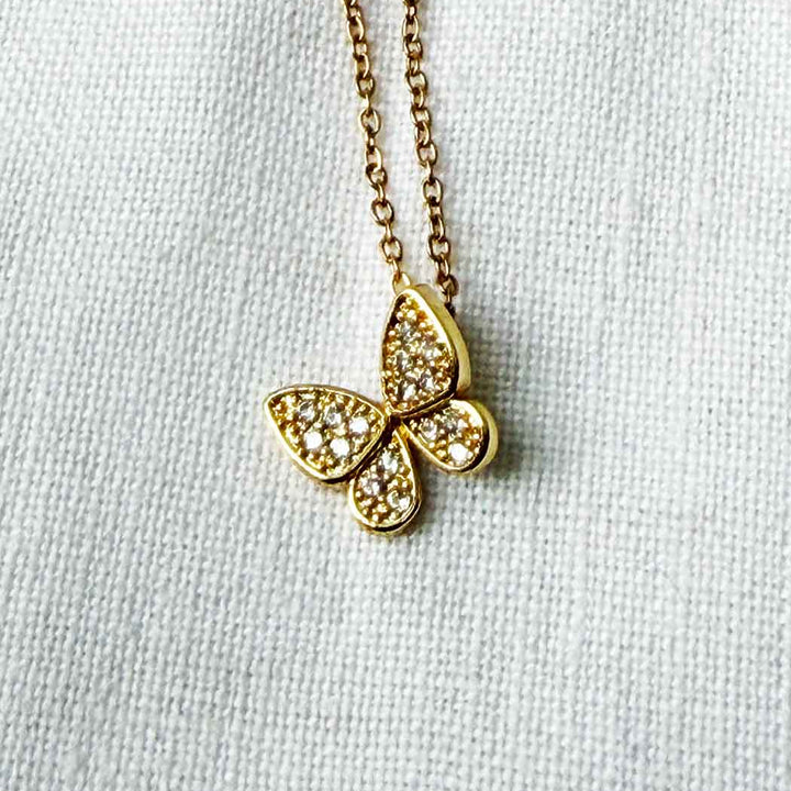 butterfly necklace on white background