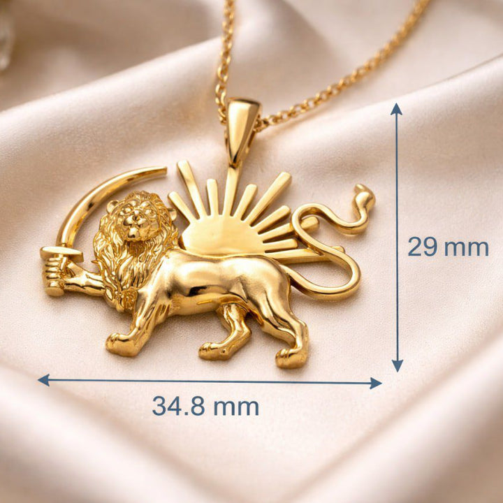 Gold lion pendant necklace with measurements on a beige fabric background