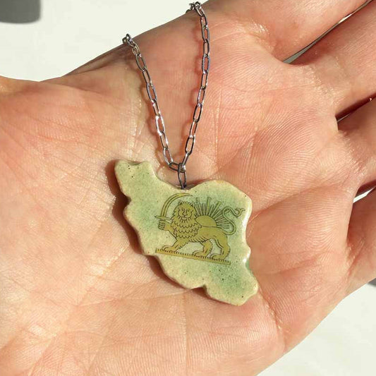 ceramic green glaze iran map lion and sun symbol on palm's hand