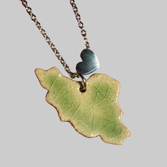 iran map ceramic necklace light green crack glazed shows on hand-1