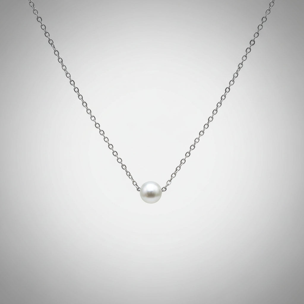 Pearl necklace on gray background.