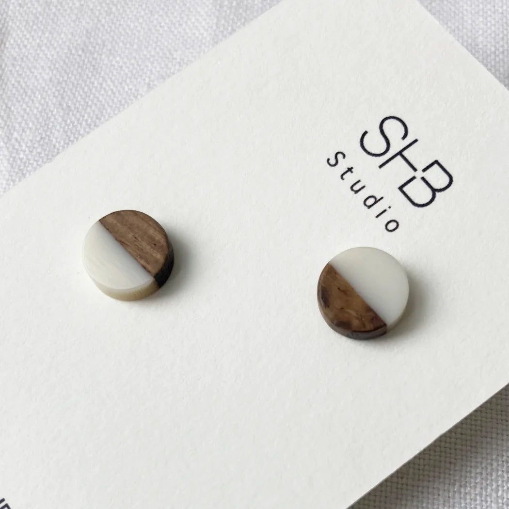 Half Wooden and half white matt colour  resin earrings on a SHB Studio card.