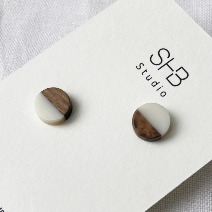 Half Wooden and half white matt colour  resin earrings on a SHB Studio card.