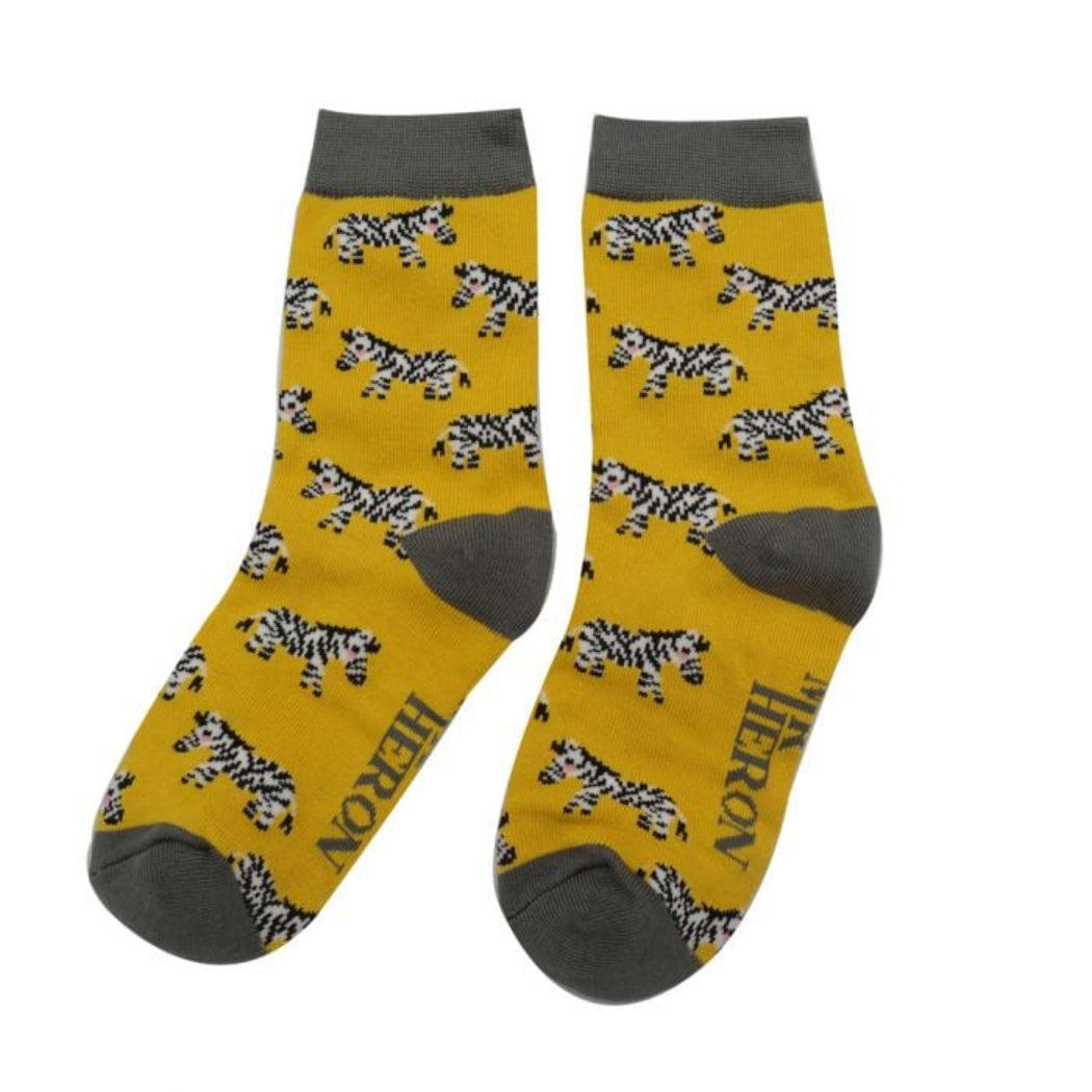 Yellow socks with zebra pattern and gray accents on a white background