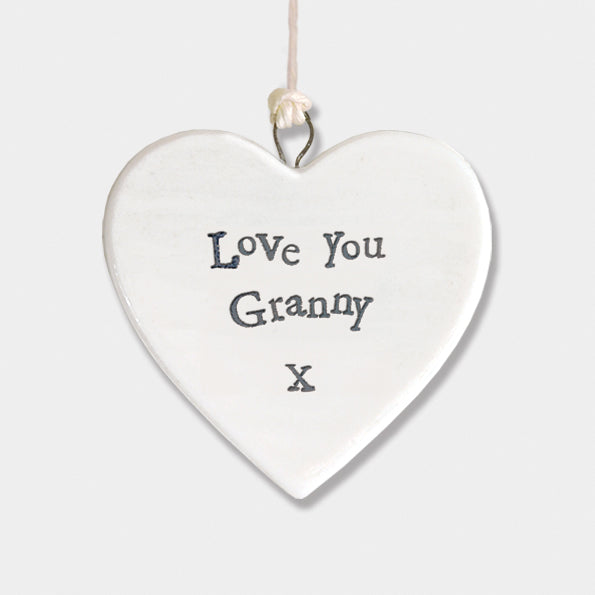 Porcelain heart hanging decoration with the words Love You Granny engraved in black text on a white ceramic heart-1