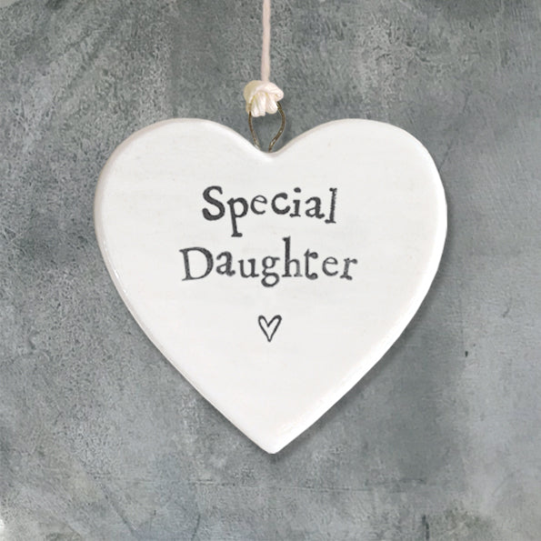 Heart-shaped plaque with 'Special Daughter' text on a gray background