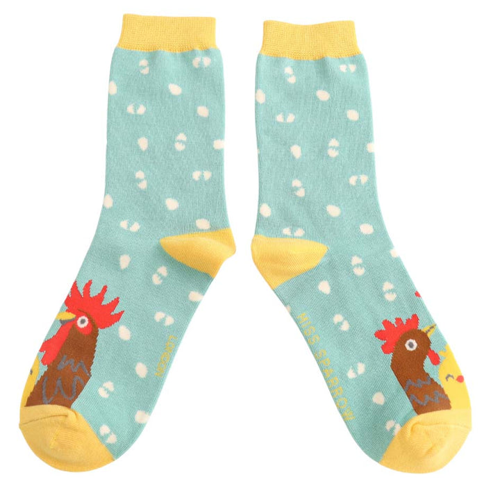 Mint green bamboo socks with chicken, rooster, chick and egg design and yellow cuff and toe.