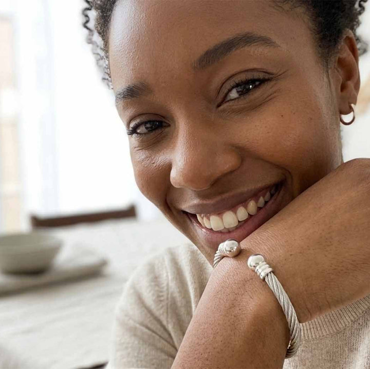 woman wearing adjustable stainless steel bangle