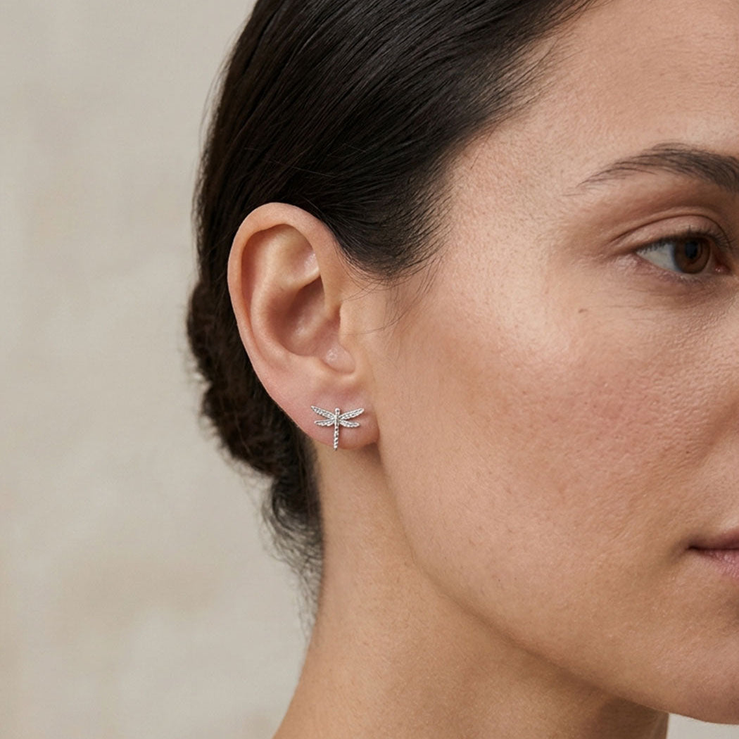 model wearing dragonfly sterling silver studs 