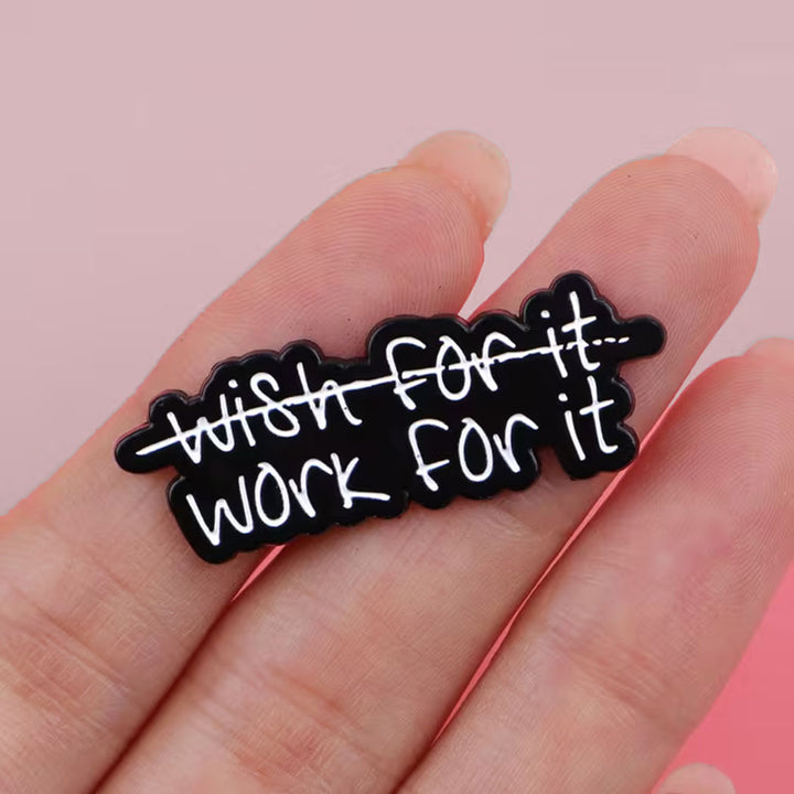 Black and white motivational pin with &