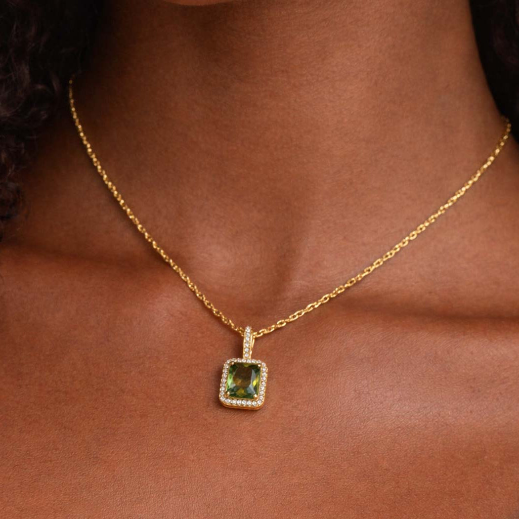 green zirconia stainless steel necklace with gold chain.