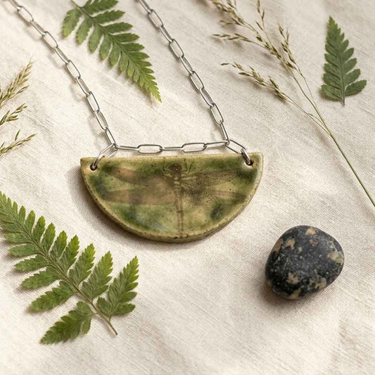 Handmade half-moon ceramic pendant necklace with a vintage dragonfly , on a stainless steel paperclip chain.
