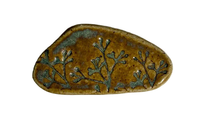 Ceramic brooch with floral design 