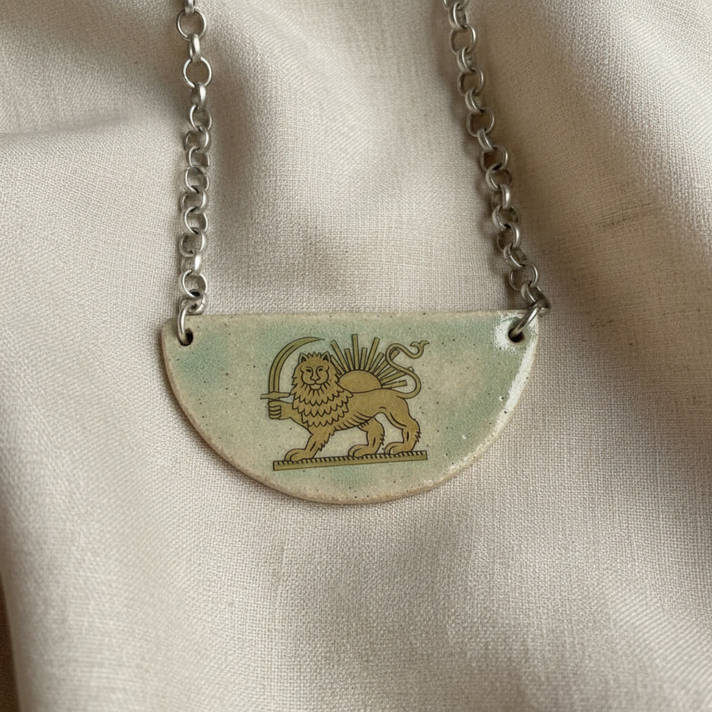 lion and sun persian symbol on half moon ceramic light green necklace