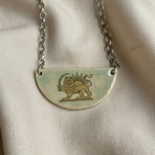 lion and sun persian symbol on half moon ceramic light green necklace
