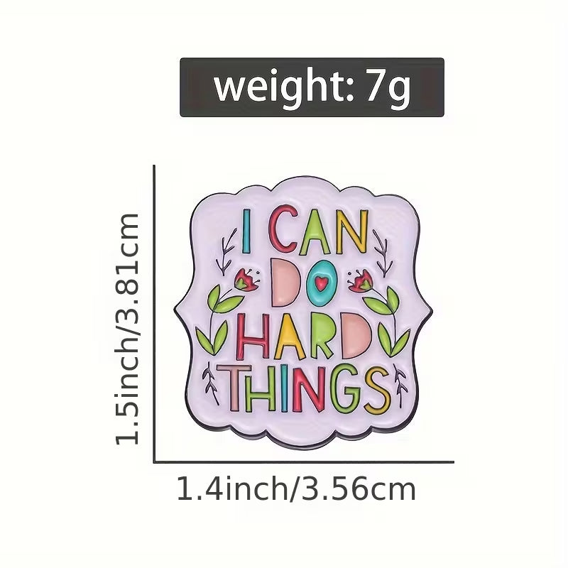 Colorful enamel pin with 'I can do hard things' text, measurements, and weight information on a white background.