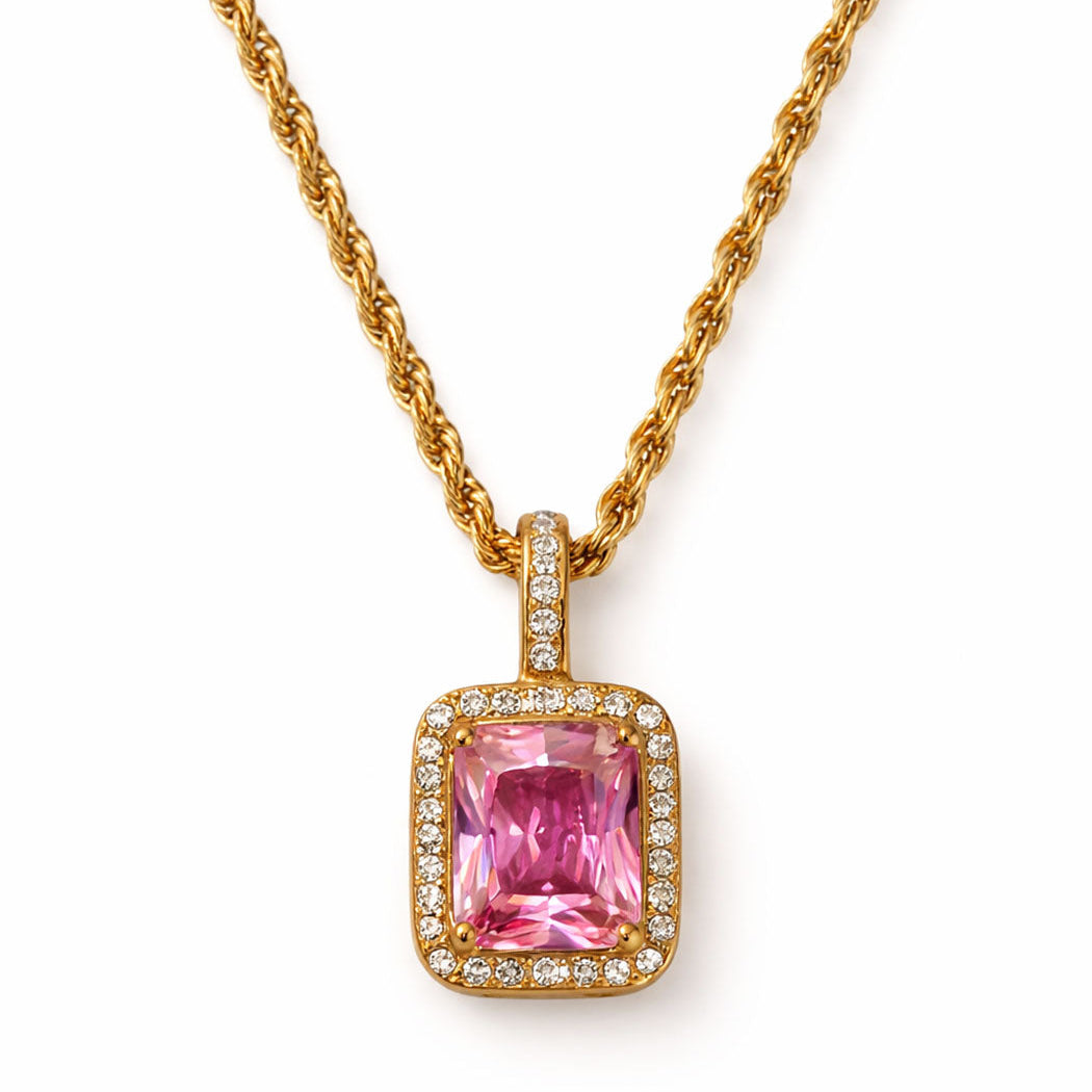 Pink gemstone pendant with gold chain on a white background