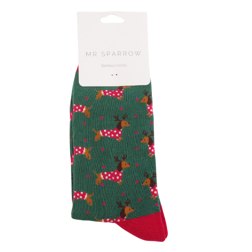 Green sock with deer pattern on a white background