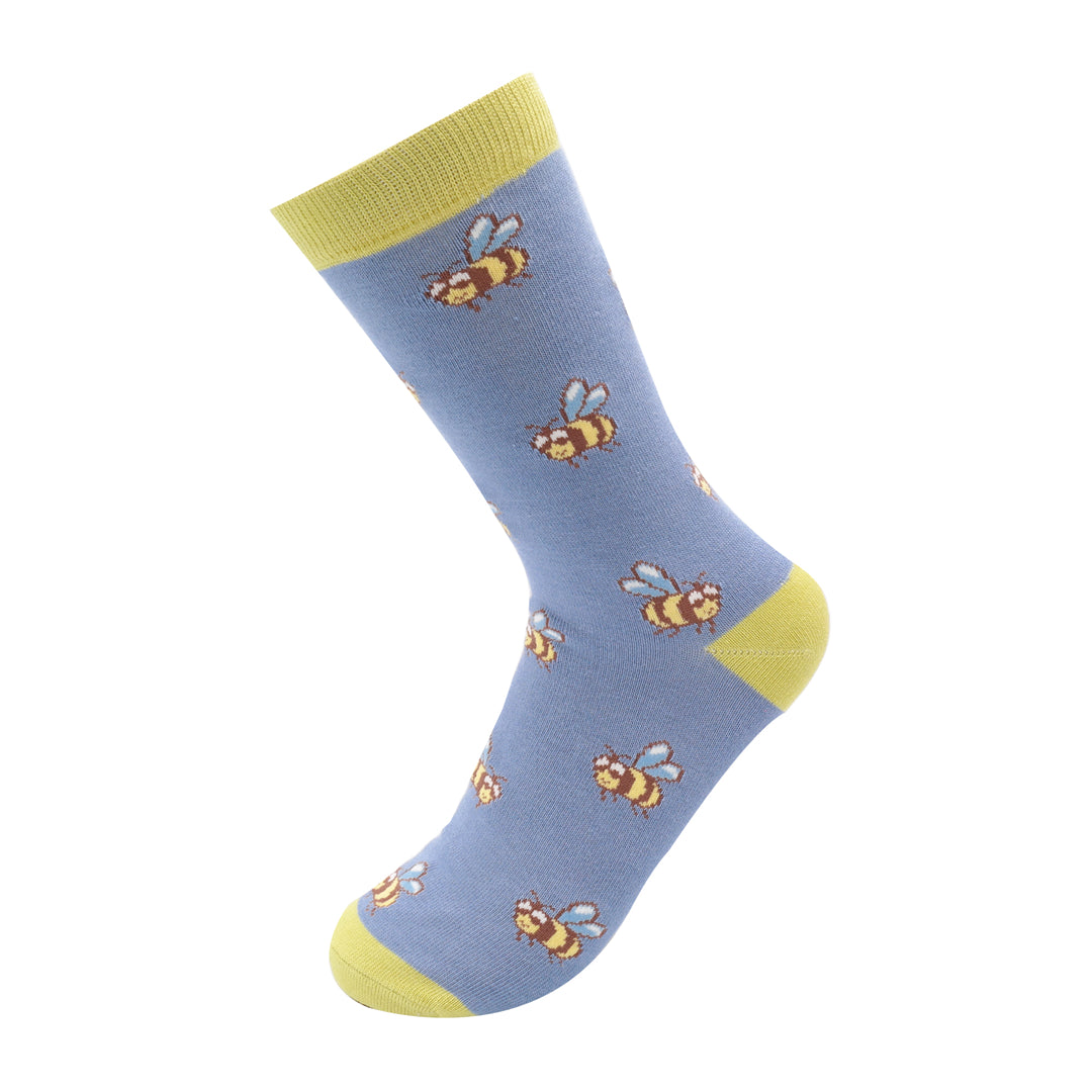 Miss Sparrow Bamboo Socks bee pattern on blue background.