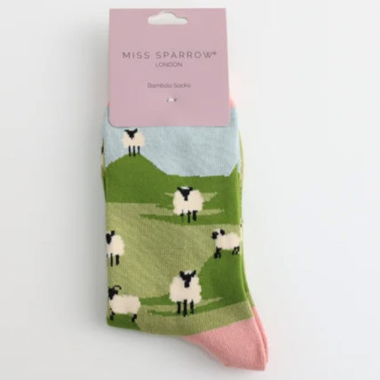 Sheep-patterned socks with 'Miss Sparrow' packaging on a white background