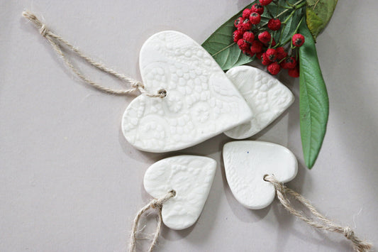 white ceramic heart shape tags. Pack of 4