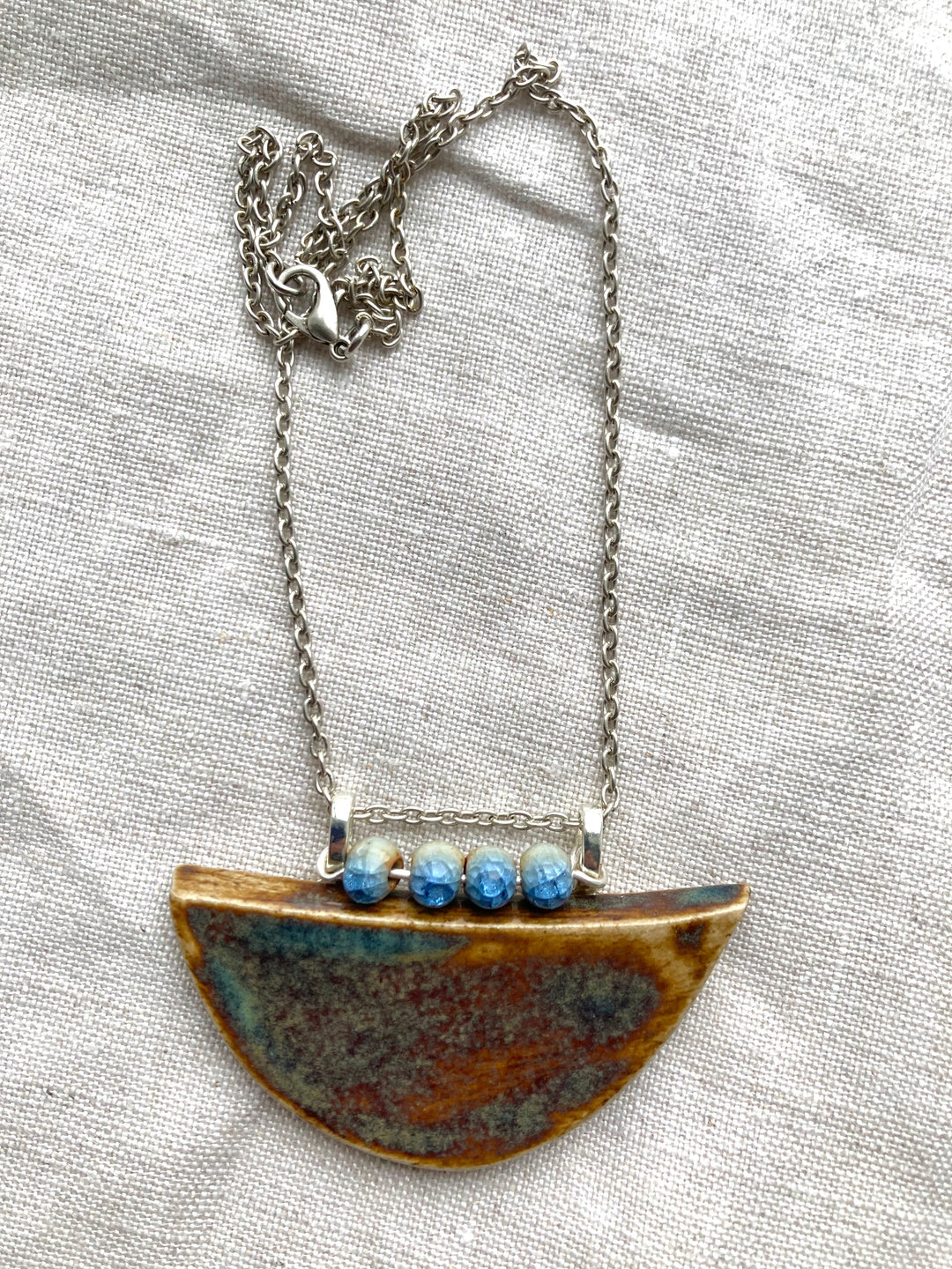Half-moon ceramic necklace handcrafted