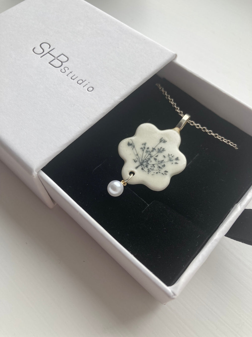 Floral ceramic pendant with pearl drop
