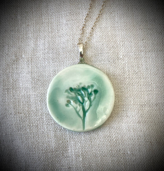 Round green ceramic floral pendant
